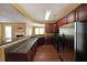 Kitchen with stainless steel appliances and breakfast bar, open to the living room at 1211 Grampian Pass # 15, Marietta, GA 30008