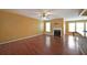 Living area featuring hardwood floors, a fireplace, and view of the kitchen at 1211 Grampian Pass # 15, Marietta, GA 30008