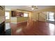 Open-concept living room and kitchen with hardwood floors, neutral paint, and plenty of natural light at 1211 Grampian Pass # 15, Marietta, GA 30008
