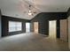 Large primary bedroom featuring vaulted ceiling, neutral carpet, and multiple doorways at 1211 Grampian Pass # 15, Marietta, GA 30008