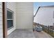 Small concrete patio area off the side of the house, perfect for a grill at 1211 Grampian Pass # 15, Marietta, GA 30008