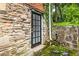 Stone foundation wall with a basement entrance at 830 Barnett Ne St # 8, Atlanta, GA 30306