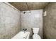 Tiled bathroom with a tub, shower, and toilet at 830 Barnett Ne St # 8, Atlanta, GA 30306