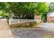 View of the street and the rear corner of the home with a cute picket fence at 830 Barnett Ne St # 8, Atlanta, GA 30306