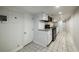 Compact kitchenette featuring white cabinets, granite countertops and stainless-steel appliances at 830 Barnett Ne St # 8, Atlanta, GA 30306