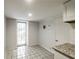 Small kitchenette area with light gray walls, white trim and a tiled floor at 830 Barnett Ne St # 8, Atlanta, GA 30306
