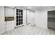 Room with tile floor, glass-paneled door, and an open doorway to another room at 830 Barnett Ne St # 8, Atlanta, GA 30306