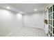 Bright room featuring tile floor, recessed lights, and a glass-paneled door at 830 Barnett Ne St # 8, Atlanta, GA 30306