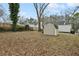 View of the expansive backyard, featuring a storage shed and access to the house at 214 Maple St, Atlanta, GA 30354