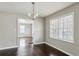 Bright dining room with hardwood floors and modern lighting at 214 Maple St, Atlanta, GA 30354
