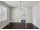 Cozy dining room with hardwood floors, neutral paint, and an adjacent kitchen at 214 Maple St, Atlanta, GA 30354
