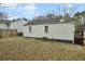 Back of house with siding, windows, small porch, and yard space at 214 Maple St, Atlanta, GA 30354