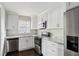 Modern kitchen featuring stainless steel appliances, white cabinets, and granite countertops at 214 Maple St, Atlanta, GA 30354