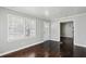 Bright living room featuring hardwood floors, freshly painted walls, and a front door at 214 Maple St, Atlanta, GA 30354