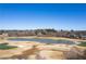 Aerial view of the golf course, lake, and homes in the distance, offering a picturesque landscape at 382 Golfview Nw Rd, Atlanta, GA 30309