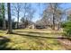A well-kept lawn and backyard with mature trees and natural beauty at 382 Golfview Nw Rd, Atlanta, GA 30309