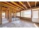 Interior room showing studs, large windows, and a door, a blank canvas for remodeling at 382 Golfview Nw Rd, Atlanta, GA 30309