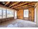 Interior room showing studs, large windows, and door, illustrating a renovation project at 382 Golfview Nw Rd, Atlanta, GA 30309