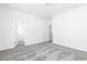 Bedroom featuring neutral carpet, white walls, and two doorways at 103 Cedar Brook Dr, Holly Springs, GA 30115