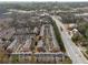An aerial view of the townhouse community surrounded by lush greenery and city skyline at 2959 Rivergreen Se Ln, Atlanta, GA 30339