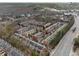 Aerial view of a community of townhouses nestled among mature trees at 2959 Rivergreen Se Ln, Atlanta, GA 30339