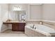 Spacious bathroom featuring a soaking tub, double vanity, and shower at 2959 Rivergreen Se Ln, Atlanta, GA 30339