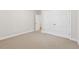 This bedroom includes carpet, a double closet, and easy access to the hallway at 2959 Rivergreen Se Ln, Atlanta, GA 30339