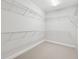 Walk-in closet with wire shelving for clothing and accessories organization at 2959 Rivergreen Se Ln, Atlanta, GA 30339