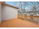 Wooden deck with railing overlooking the surrounding landscape and neighboring properties at 2959 Rivergreen Se Ln, Atlanta, GA 30339