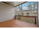 Screened deck showing wood flooring with a wooded view at 2959 Rivergreen Se Ln, Atlanta, GA 30339