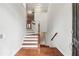 Inviting home entryway with hardwood floors and staircase with wooden handrail at 2959 Rivergreen Se Ln, Atlanta, GA 30339
