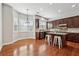 Bright kitchen with granite countertops, dark cabinets, stainless steel appliances, and island with seating at 2959 Rivergreen Se Ln, Atlanta, GA 30339
