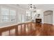 Open living room area featuring hardwood floors, bright windows, and a marble fireplace at 2959 Rivergreen Se Ln, Atlanta, GA 30339