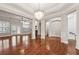 Spacious living room featuring hardwood floors, bright windows, and an elegant chandelier at 2959 Rivergreen Se Ln, Atlanta, GA 30339