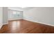 Spacious living room featuring gleaming hardwood floors, neutral walls, and a bright window at 2959 Rivergreen Se Ln, Atlanta, GA 30339