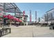 View of the plaza with overhead steel and the Atlanta Braves stadium in the background on a sunny day at 2959 Rivergreen Se Ln, Atlanta, GA 30339
