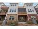 Multi-story rear exterior features brick and siding, along with multiple decks and patios at 2959 Rivergreen Se Ln, Atlanta, GA 30339