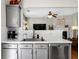 View of the kitchen countertops, sink, and stainless steel appliances in an open-concept layout at 404 Glenleigh Dr, Canton, GA 30114