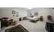 Bright bedroom with carpet flooring, a comfortable bed, and a large window letting in natural light at 5525 Whitner Dr, Sandy Springs, GA 30327