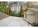 Large driveway with a spacious two-car garage providing ample parking at 5525 Whitner Dr, Sandy Springs, GA 30327