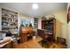 Well-lit home office with built-in bookshelves and a comfortable workspace at 5525 Whitner Dr, Sandy Springs, GA 30327