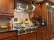 Chef's kitchen with a professional range, custom vent hood, and ample counter space for meal preparation and entertainment at 5525 Whitner Dr, Sandy Springs, GA 30327