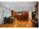 Open-concept kitchen features custom cabinets, stainless appliances, and an island that leads to the dining and entertaining area at 5525 Whitner Dr, Sandy Springs, GA 30327