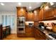 Modern kitchen featuring stainless steel appliances, custom wood cabinets, and plenty of natural light from the large windows at 5525 Whitner Dr, Sandy Springs, GA 30327