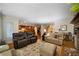 Spacious living room with hardwood floors, fireplace, a plush rug, and comfortable seating with bright light at 5525 Whitner Dr, Sandy Springs, GA 30327