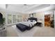 Relaxing main bedroom with tray ceiling, a private balcony and sitting area at 5525 Whitner Dr, Sandy Springs, GA 30327