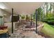 Stone patio leading to steps with stone retaining walls and a landscaped backyard at 5525 Whitner Dr, Sandy Springs, GA 30327