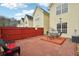Cozy outdoor area features a red brick patio and fence, inviting relaxation and entertainment at 2403 Brianna Dr, Hampton, GA 30228