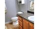 Functional bathroom showcasing a toilet, vanity with solid surface countertop, and practical storage at 2403 Brianna Dr, Hampton, GA 30228