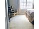 Bright bedroom featuring a comfortable chair and window with curtains, creating a cozy and inviting space at 2403 Brianna Dr, Hampton, GA 30228